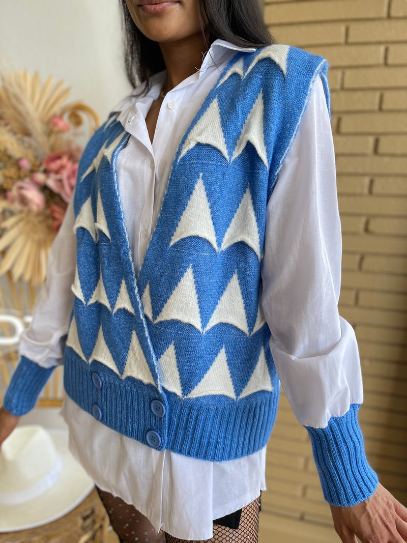 white blouse and blue knbit sweater