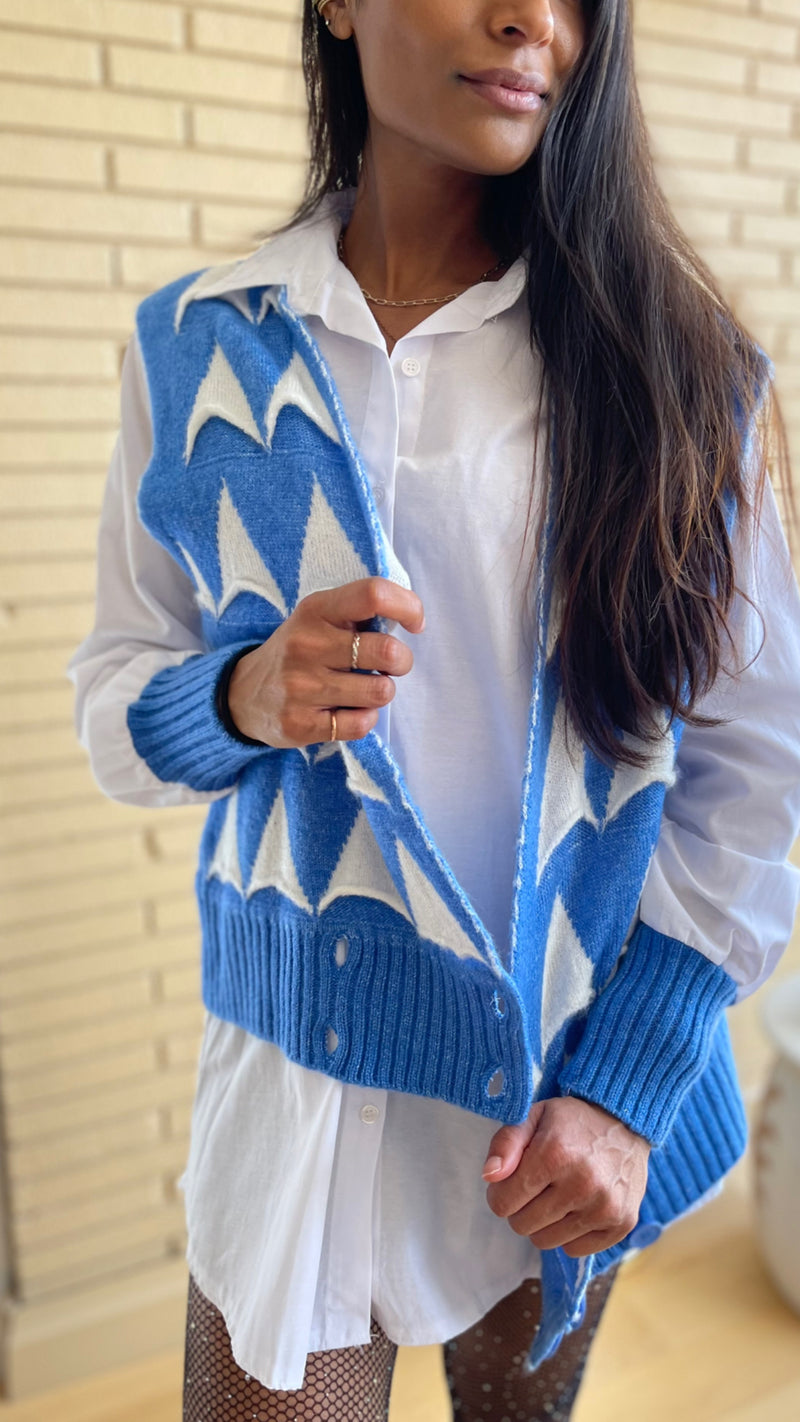 white blouse and blue knbit sweater